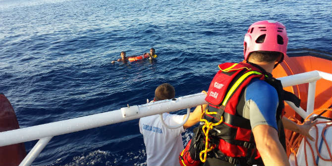 A Cry for Those in Peril on the Sea The Italian coastguard rescues two of the 156 survivors of the October 3 tragedy off Lampedusa Island. Credit: Guardia Costiera/UNHCR via Flickr (http://bit.ly/1RwgKvC) CC BY-NC 2.0