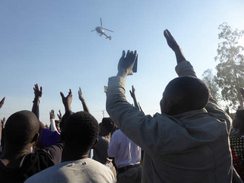 Zambian mobile phone users taking photos of helicopter landing of UPND’s presidential candidate, Hakainde Hichilema at a rally in Mandevu, Lusaka Photo Credit: Wendy Willems