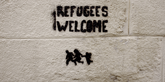 Refugees Welcome graffiti on a wall