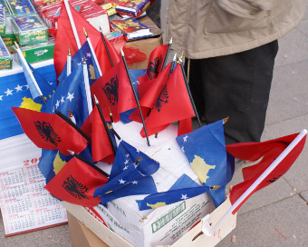 Kosovo and Albanian flags on sale in Pristina, Credit: David Bailey MBE (CC-BY-SA-3.0)