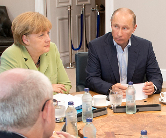 Vladimir Putin and Angela Merkel, Credit: G8 UK (CC-BY-SA-3.0)