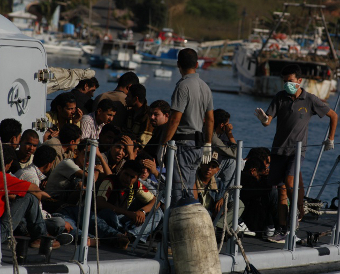 Migrants arriving at Lampedusa, Credit: Noborder Network (CC-BY-SA-3.0)