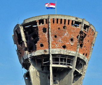 The damaged water tower in Vukovar, Croatia, which remains a symbol of the Battle of Vukovar in 1991, Credit: anjči (CC-BY-SA-3.0) 