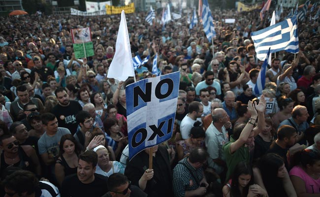 Greek protesters hold a placard on July 3 reading 'No' during a demonstration calling for a 'No' vote in today's referendum in Athens (Agence France-Presse Photo) 