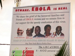 A billboard in Freetown. On the third day of my mission in Sierra Leone, Ebola took the life of Dr Godfrey George, adding to this list and further deepening the dent on the country's health system at this critical time. Photograph: Helen Mayelle/Save the Children/Sierra Leone