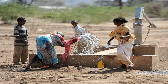 US_Navy_110311-N-SN160-227_Ethiopian_children_play_in_the_water_of_a_well_built_by_Seabees_assigned_to_Naval_Mobile_Constructio