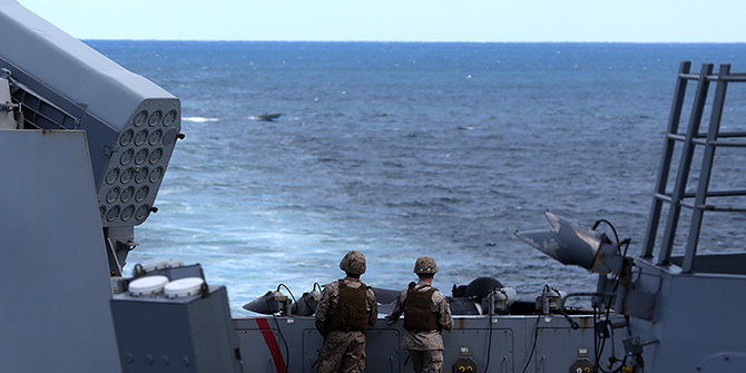 Marines as the ship passes through the Strait of Hormuz. © U.S. Naval Forces Central Command/U.S. Fifth Fleet, 2014.