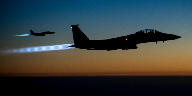 Two U.S. Air Force F-15E Strike Eagle aircraft fly over northern Iraq Sept. 23, 2014, after conducting airstrikes in Syria. (DoD photo by Senior Airman Matthew Bruch, U.S. Air Force/Released)
