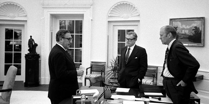 President Ford meets in the Oval Office with Secretary of State Henry A. Kissinger and Vice President Nelson A. Rockefeller to discuss the American evacuation of Saigon, Oval Office, White House, Washington DC.. 1975 Credit: Wikimedia Commons