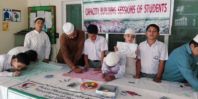 As part of PAIMAN's Inclusive Peace Education Programme, students from private schools and Madrassas undertake creative work together - as seen here during a painting and poetry competition. 